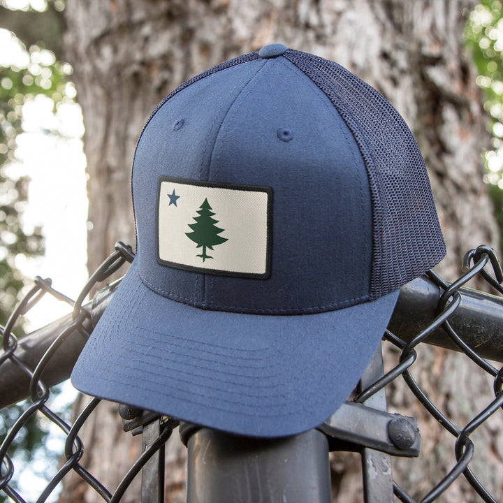 The Perfect Accessory for Maine Lovers: Vintage Maine Flag Merch