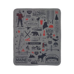Maine fleece sherpa blanket laid flat with black landmarks, lobster and wildlife illustrations and red accents on gray