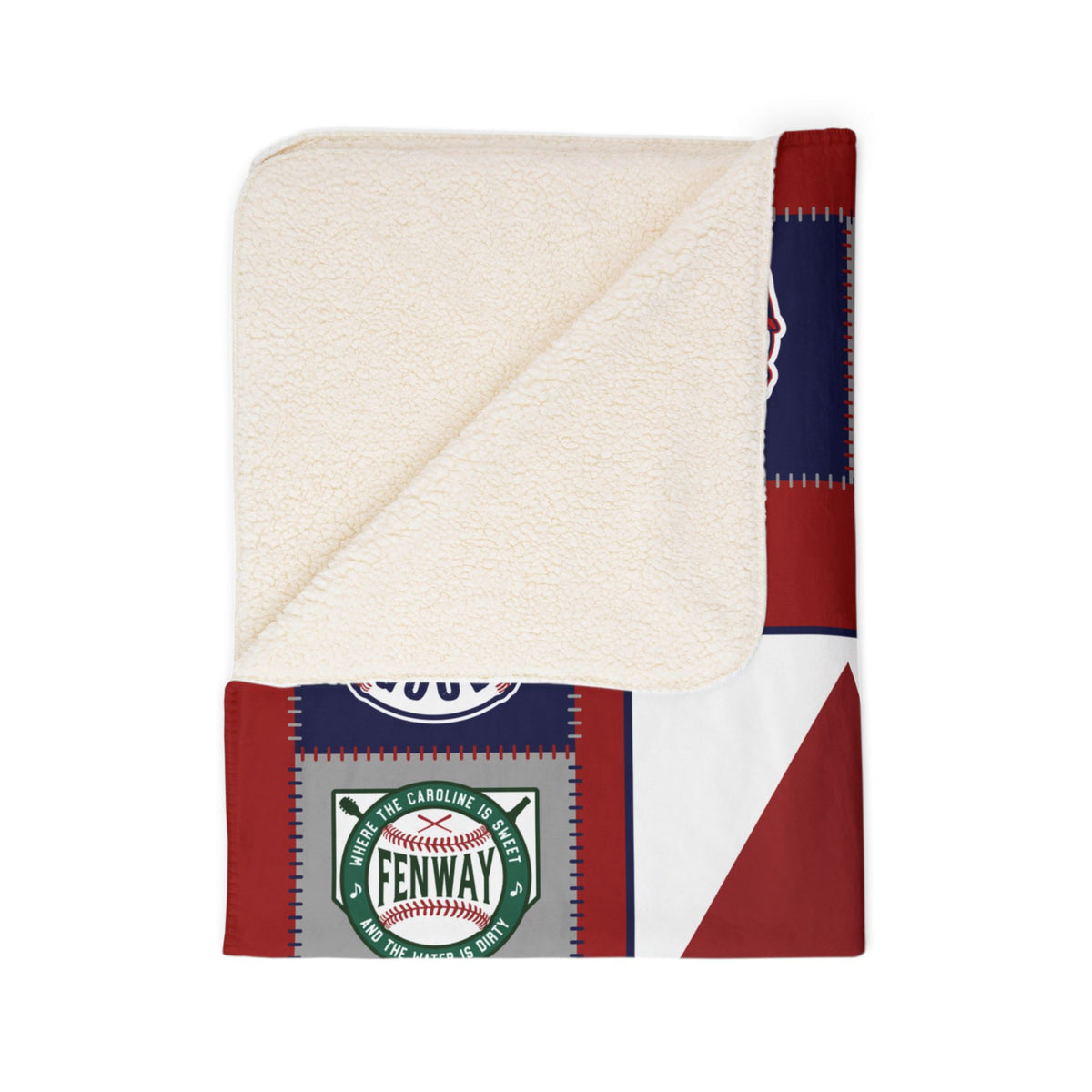 Folded corner of Boston baseball blanket showing cream sherpa underside and Fenway print