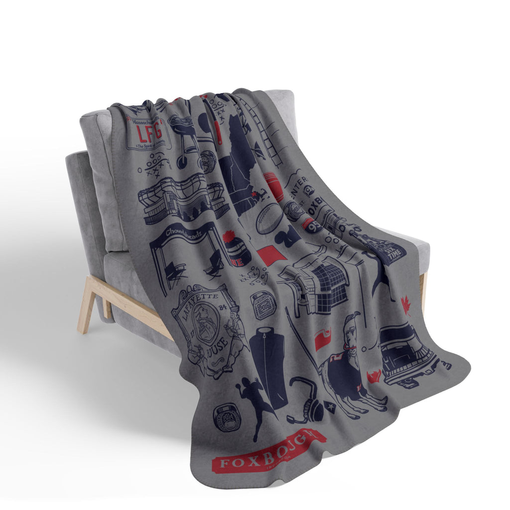 Gray Foxboro football tourist-attraction fleece blanket draped over a chair