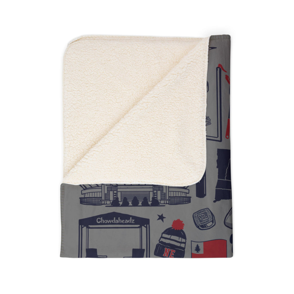Folded Foxboro football blanket showing cream sherpa underside and gray illustrated fleece front