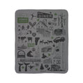 Vermont fleece sherpa blanket laid flat with black landmarks, maple syrup and wildlife illustrations and green accents on gray