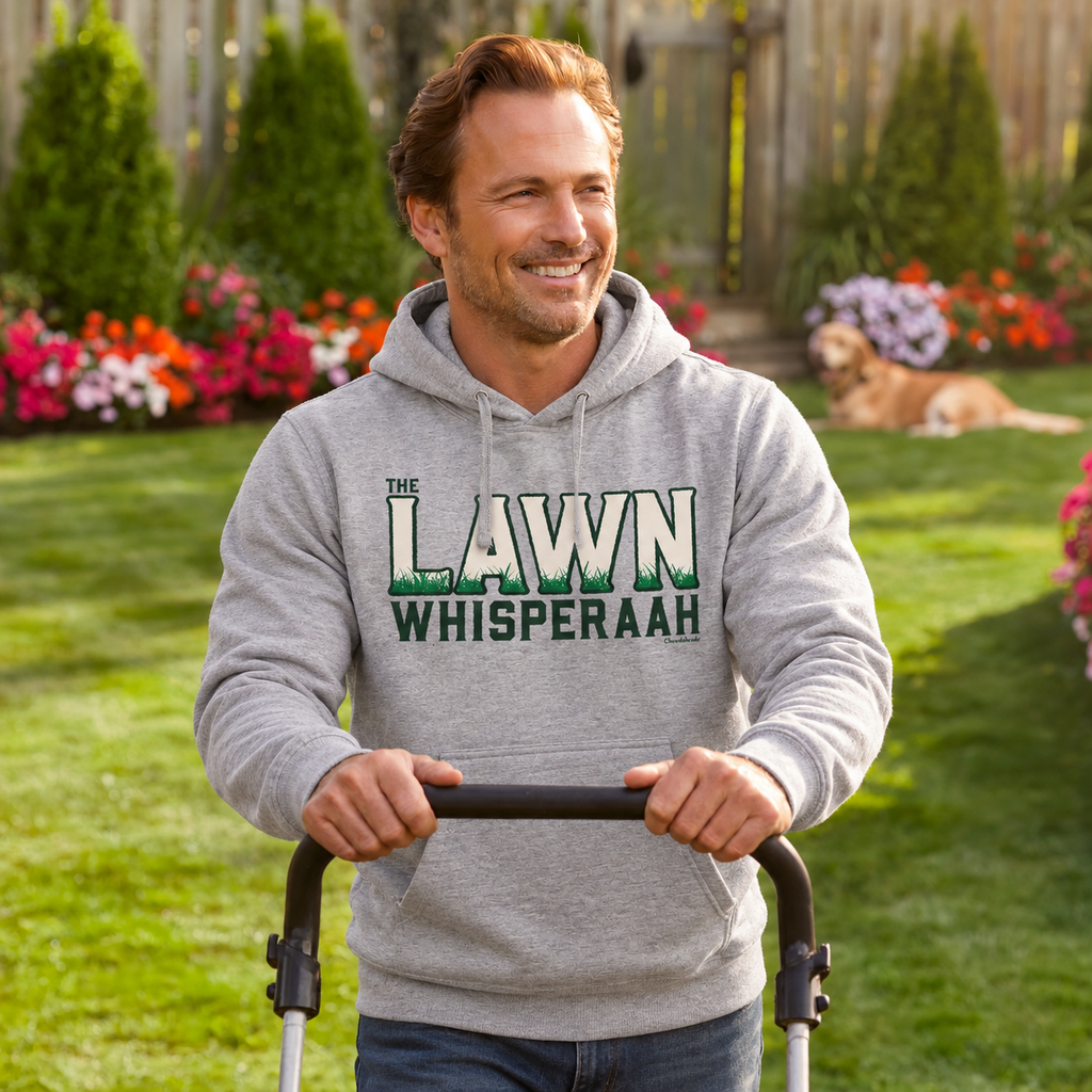 Man wearing a gray Lawn Whisperaah hoodie while holding a lawn mower handle in a backyard