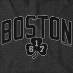 Close-up of black BOSTON lettering and a 617 shamrock outlined in gray on charcoal fabric