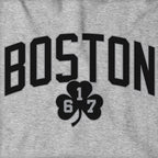 Close-up of black BOSTON arch lettering and 617 shamrock on gray fabric