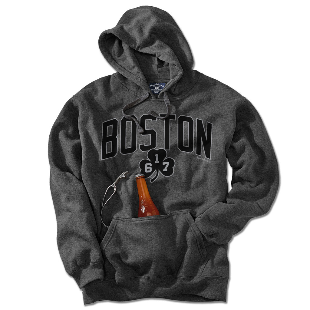Front view of charcoal Tailgater Hoodie with black BOSTON arch, 617 shamrock, and bottle in the beverage pouch