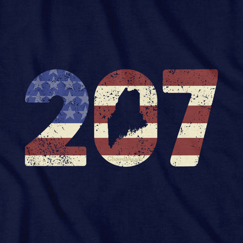 Close-up of navy Patriotic 207 t-shirt design — area code and flag detail