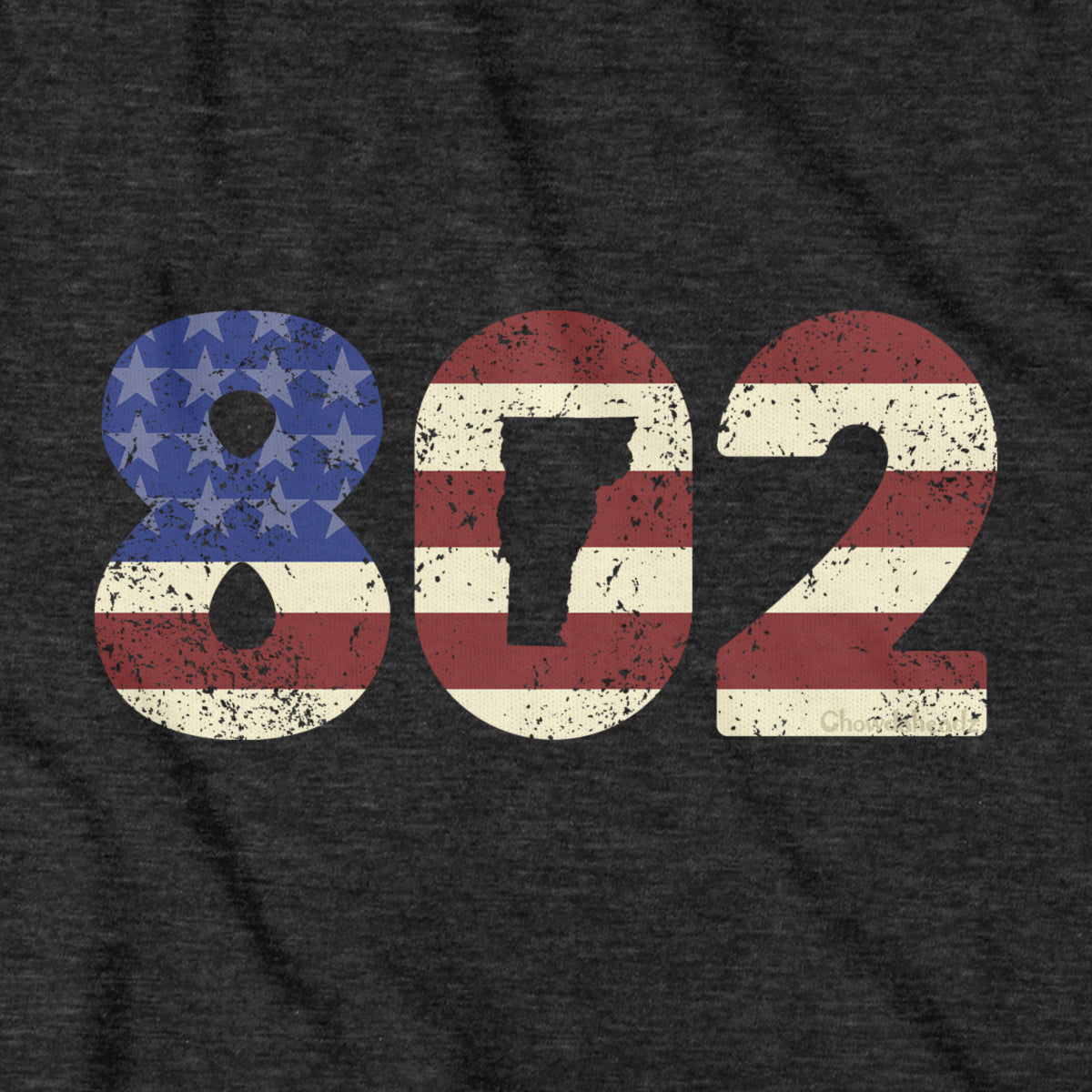 Close-up of charcoal Patriotic 802 t-shirt design — area code and flag detail