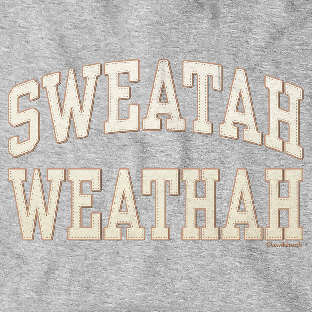 Close-up of cream-and-tan Sweatah Weathah lettering with stitch-style detailing on gray fabric