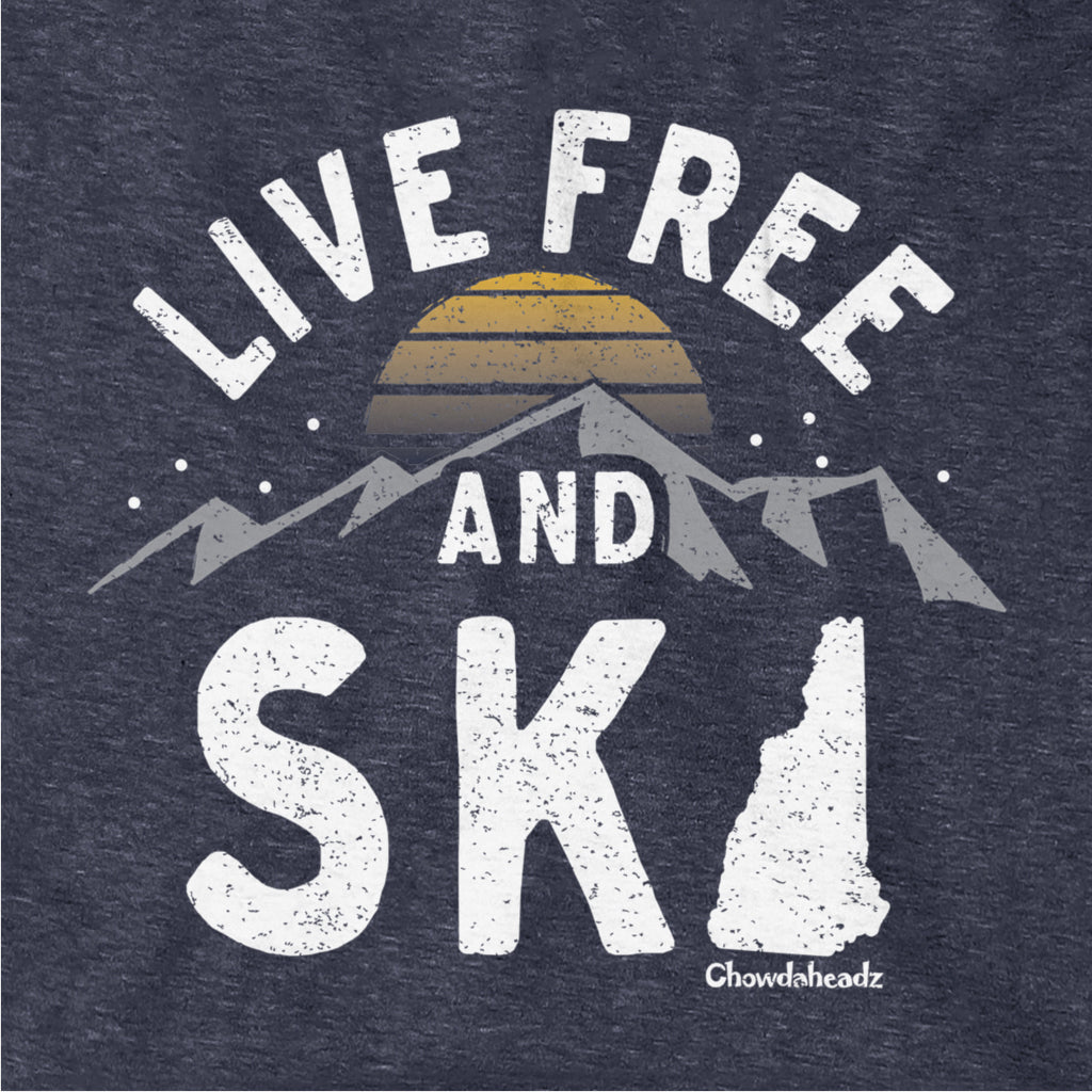 Close-up of distressed Live Free And Ski lettering, mountain range, striped sunset and New Hampshire silhouette on Heather Blue fabric