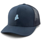 Three-quarter front view of a navy Mini Maine snapback trucker hat with a small light-blue Maine silhouette