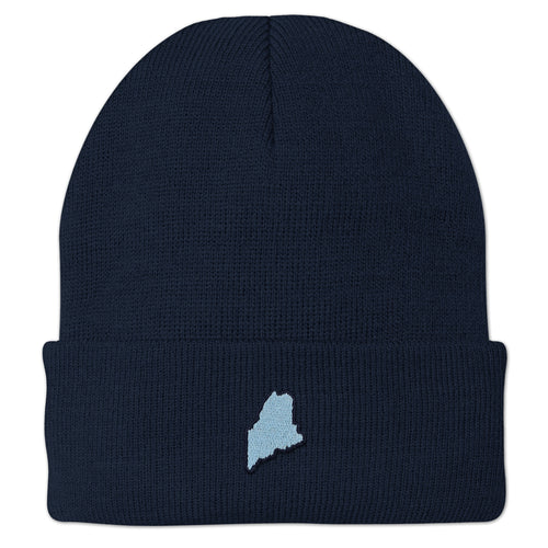 Front view of a navy cuffed knit hat with a small light-blue Maine-shaped patch outlined in dark thread