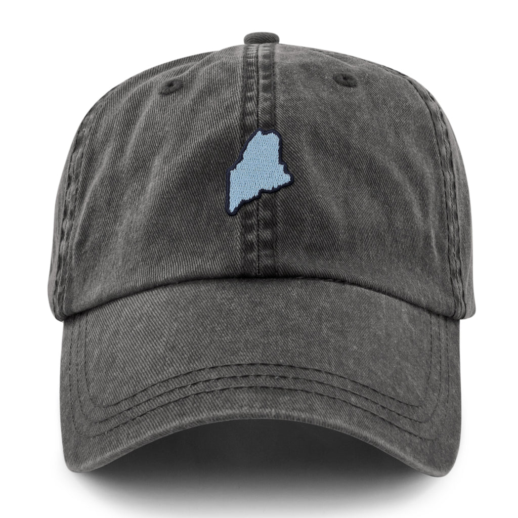 Straight-on front view of a washed charcoal dad hat with a light-blue Maine-shaped patch outlined in dark thread