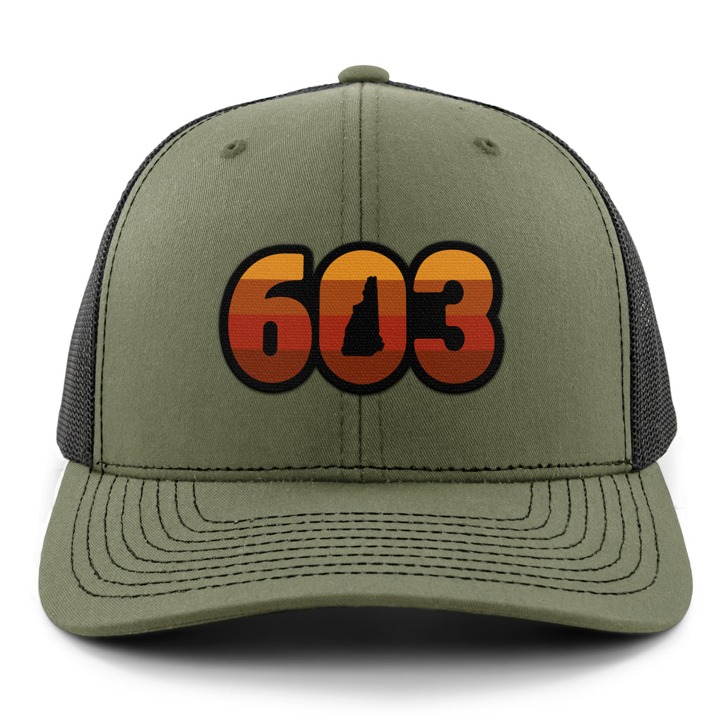 Front view of a military green Retro 603 New Hampshire snapback trucker hat with orange-and-red-striped numbers and a state silhouette in the zero