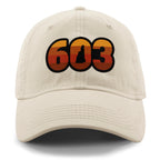 Front view of a stone Retro 603 New Hampshire dad hat with orange-and-red-striped numbers and a state silhouette in the zero