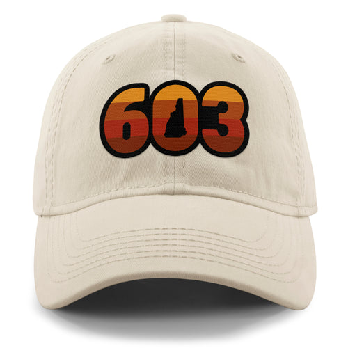 Front view of a stone Retro 603 New Hampshire dad hat with orange-and-red-striped numbers and a state silhouette in the zero