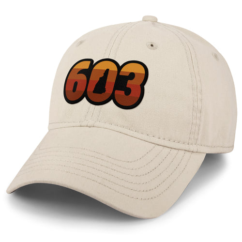 Three-quarter front view of a stone Retro 603 New Hampshire dad hat with orange-and-red-striped numbers and a state silhouette in the zero