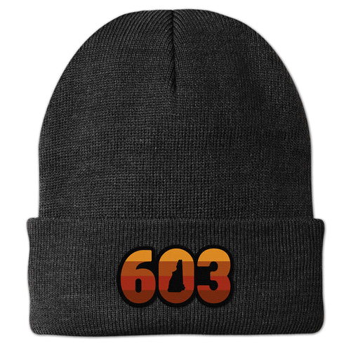 Front view of a charcoal Retro 603 New Hampshire cuff knit hat with orange-and-red-striped numbers and a state silhouette in the zero