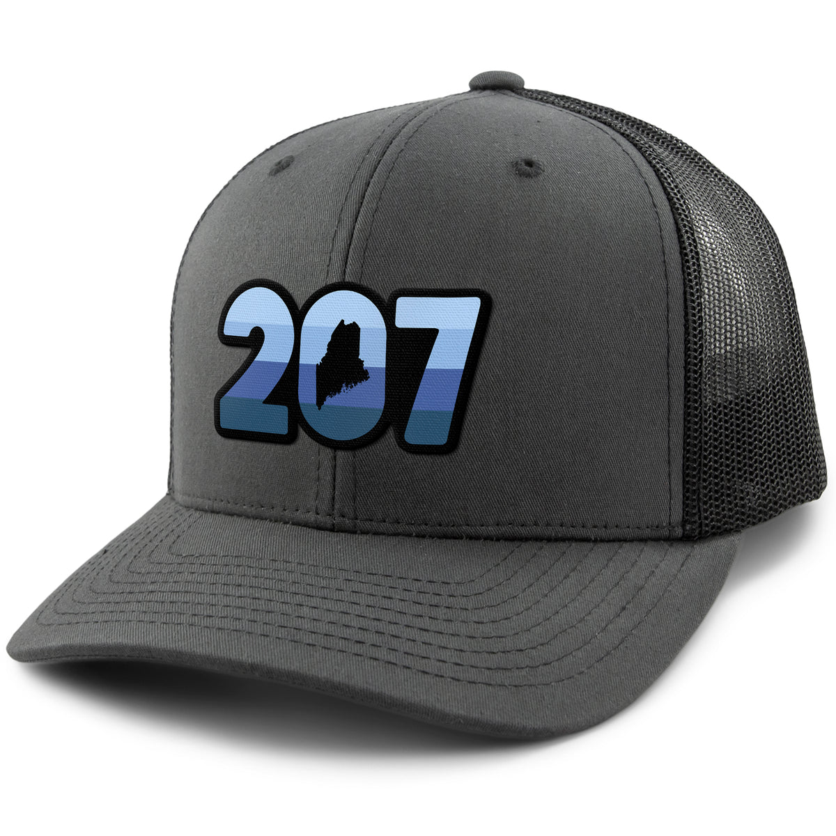 Three-quarter front view of a charcoal Retro 207 Maine snapback trucker hat with blue-striped numbers and a state silhouette in the zero