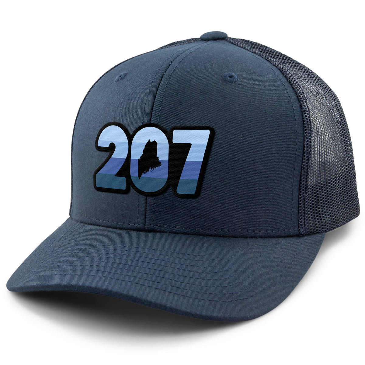 Three-quarter front view of a navy Retro 207 Maine snapback trucker hat with blue-striped numbers and a state silhouette in the zero