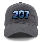 Front view of a charcoal Retro 207 Maine dad hat with blue-striped numbers and a state silhouette in the zero