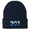 Front view of a navy Retro 207 Maine cuff knit hat with blue-striped numbers and a state silhouette in the zero