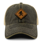 Bigfoot Crossing Sign Wood Grain Patch Dirty Water Trucker Hat