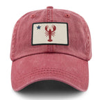 Front of cardinal Maine Lobster Flag washed dad hat with lobster-and-star Maine flag patch