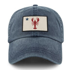 Front of navy Maine Lobster Flag washed dad hat with lobster-and-star Maine flag patch