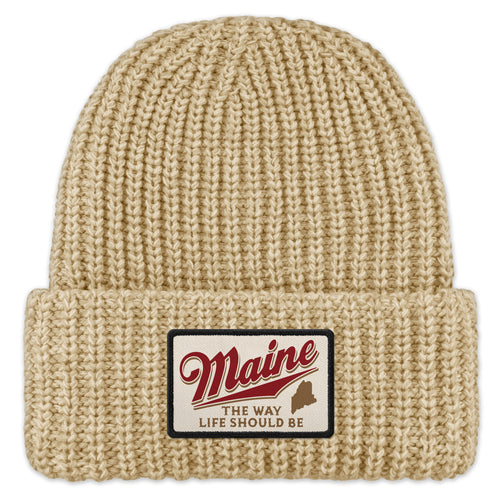 Front of oatmeal chunky knit hat with folded cuff and Maine The Way Life Should Be patch