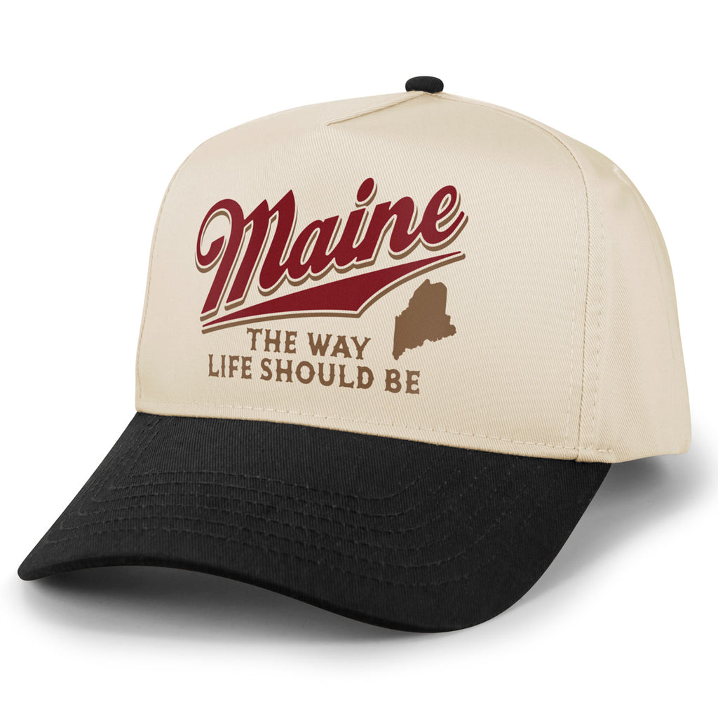 Angled view of stone retro snapback with black brim and red Maine The Way Life Should Be design