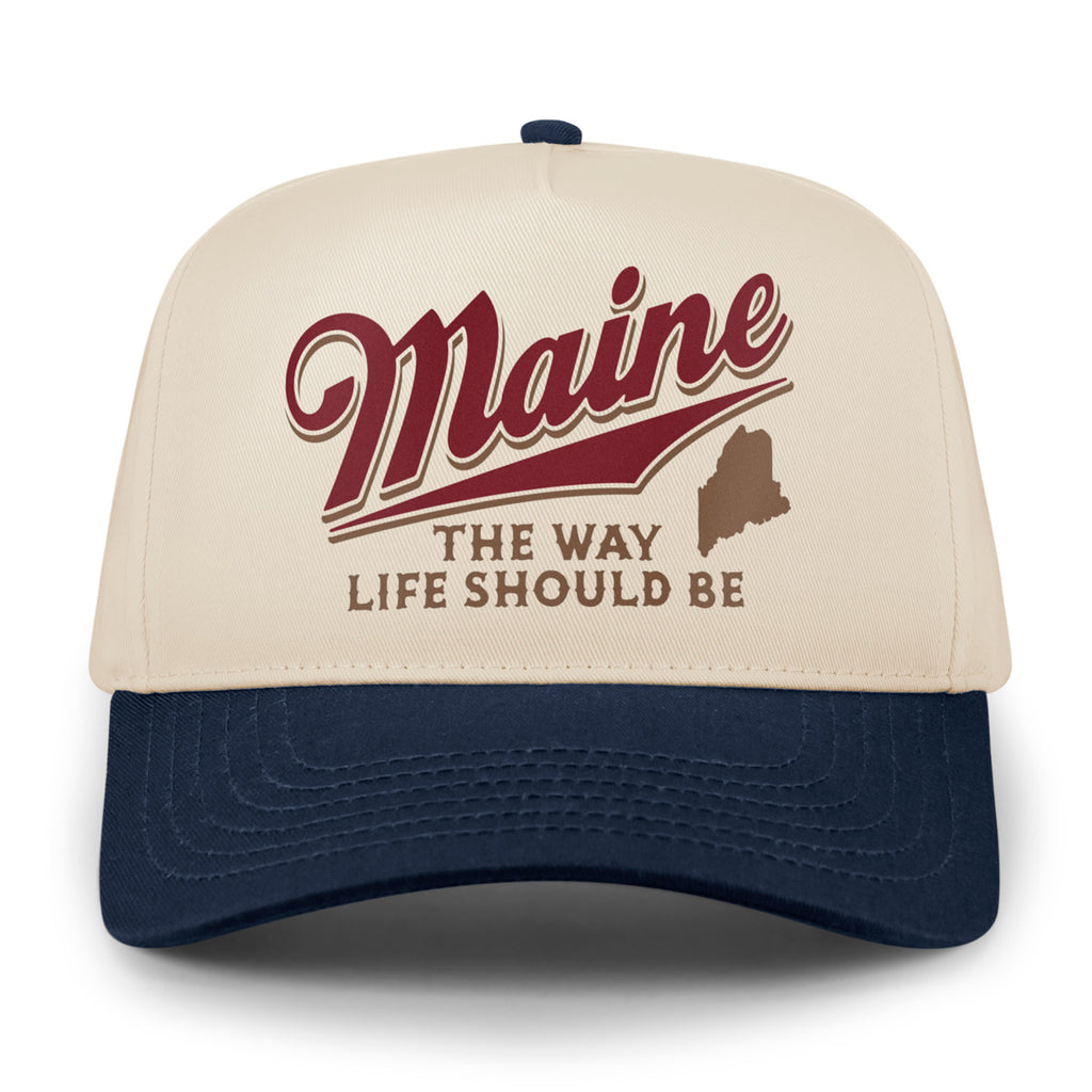 Front of stone retro snapback with navy brim, red Maine script and brown state silhouette