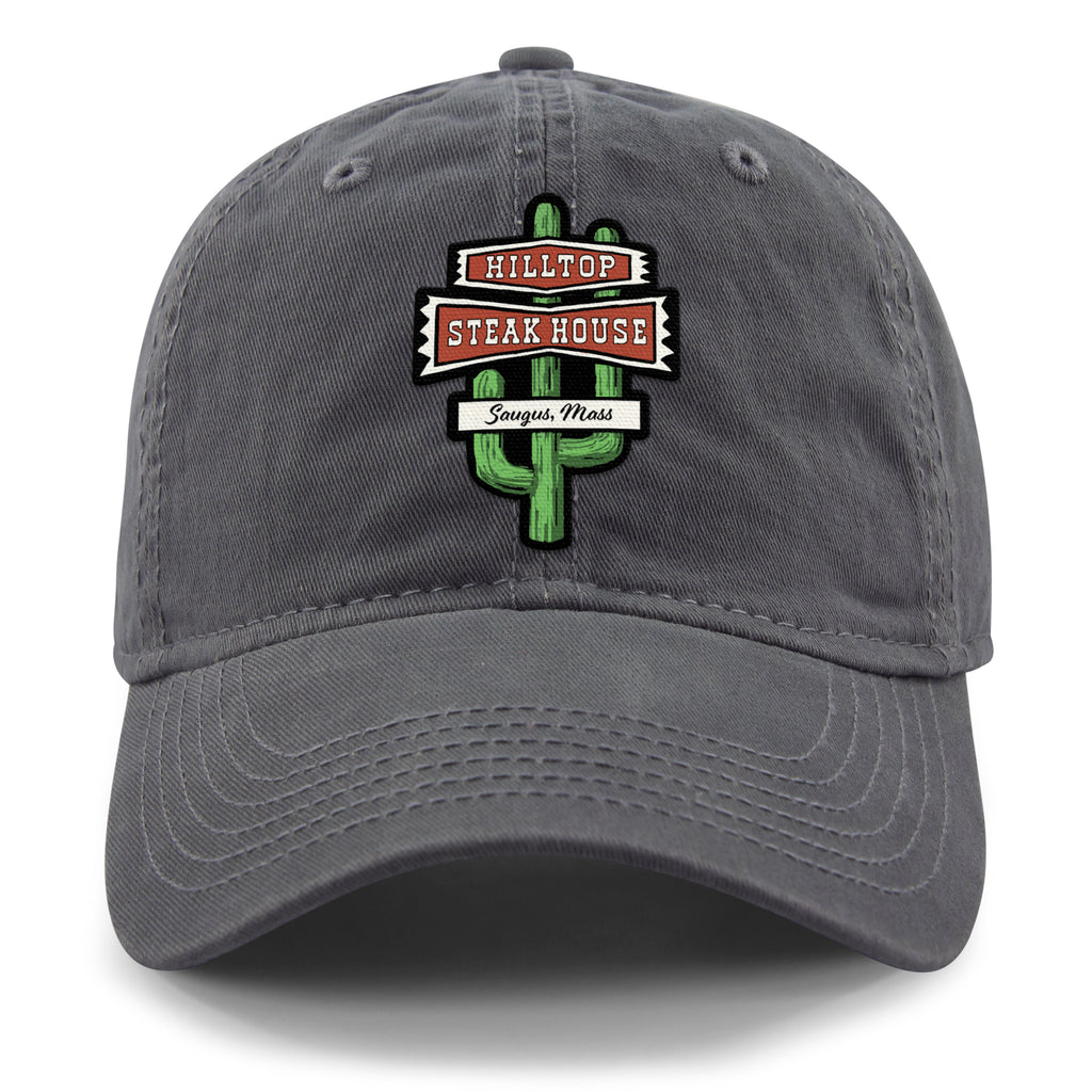 Front view of charcoal Hilltop Steakhouse dad hat with green cactus sign and Saugus, Mass lettering
