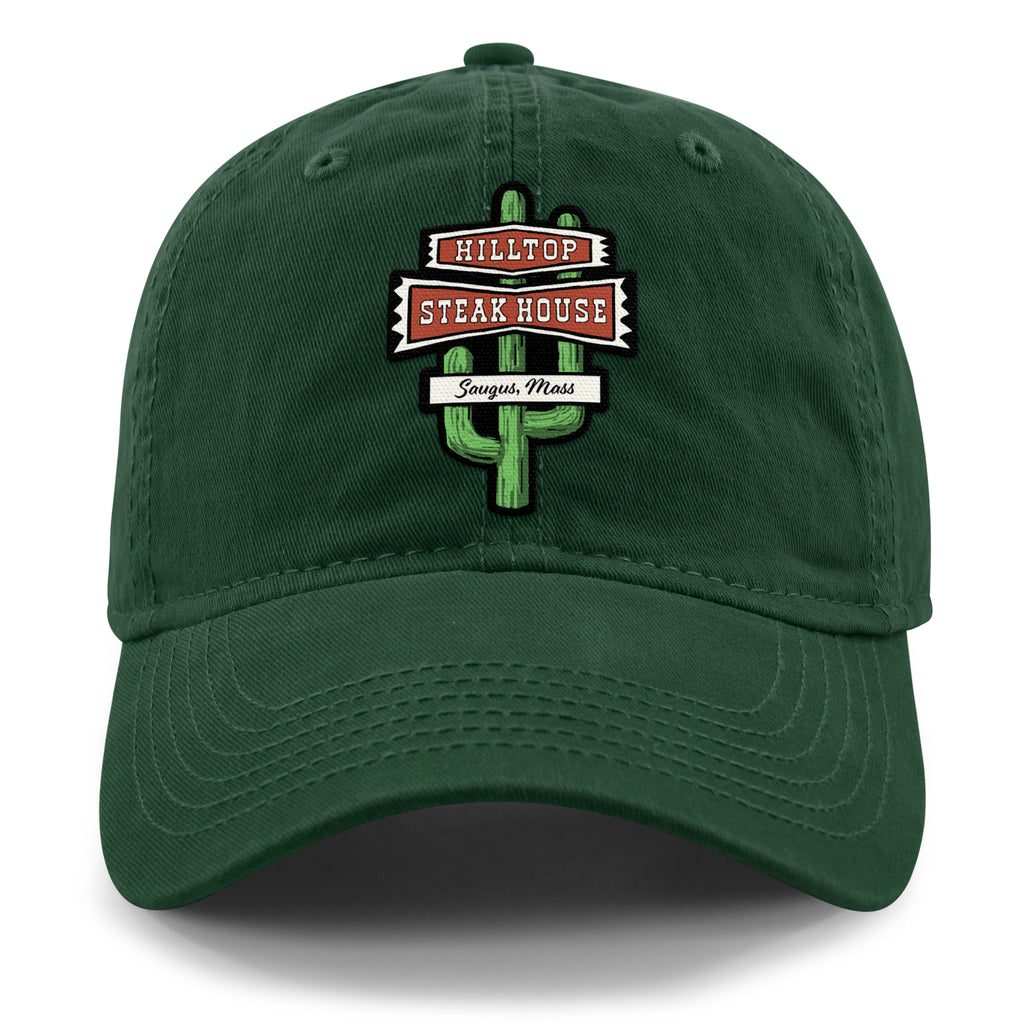 Front view of dark green Hilltop Steakhouse dad hat with green cactus sign and Saugus, Mass lettering