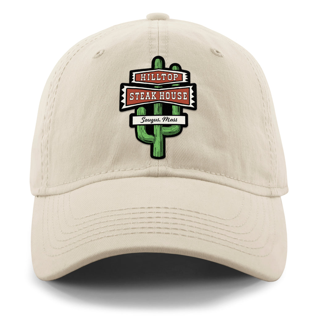 Front view of stone Hilltop Steakhouse dad hat with green cactus sign and Saugus, Mass lettering
