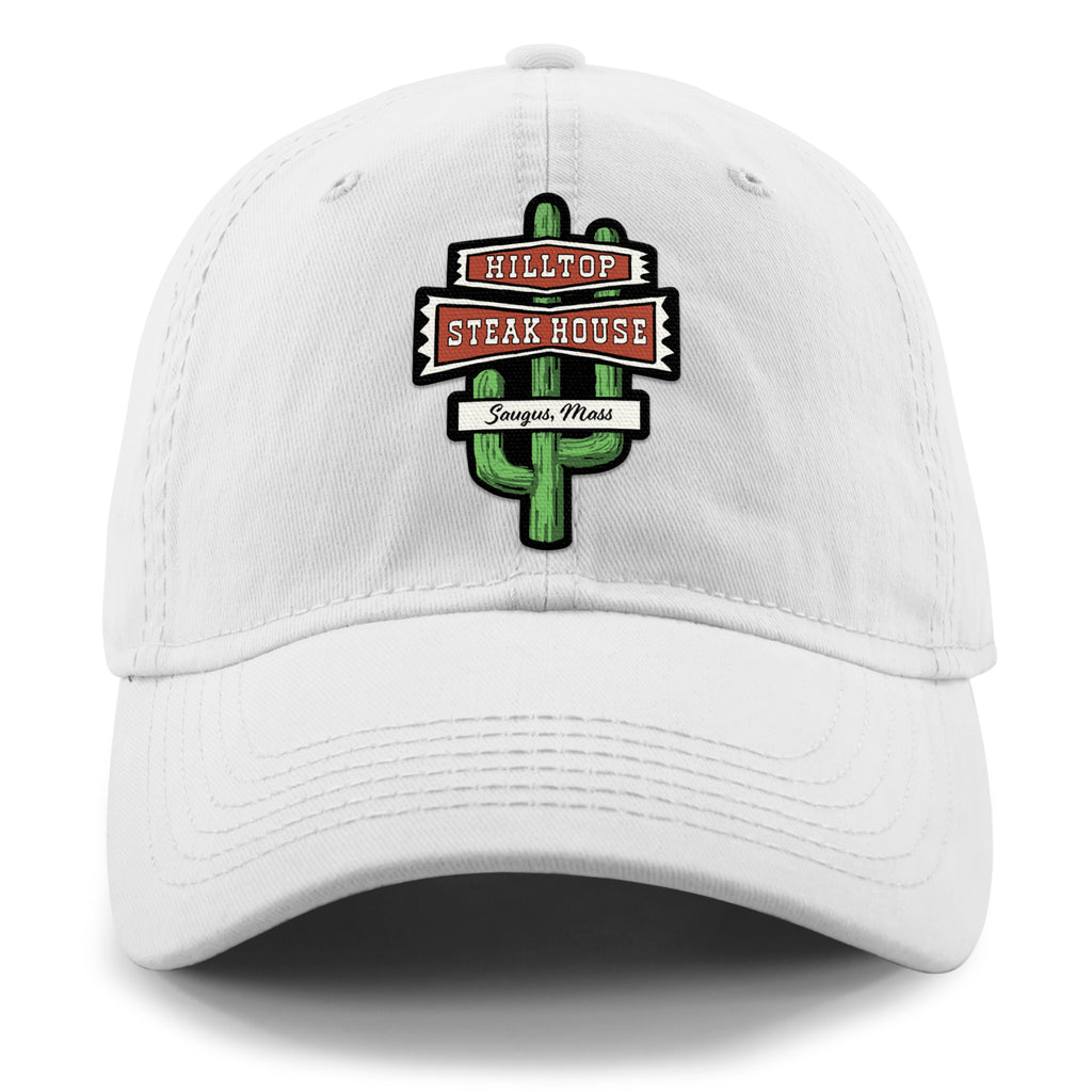 Front view of white Hilltop Steakhouse dad hat with green cactus sign and Saugus, Mass lettering