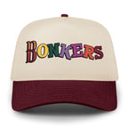 Front of maroon and stone Bonkers Funhouse hat with multicolor lettering