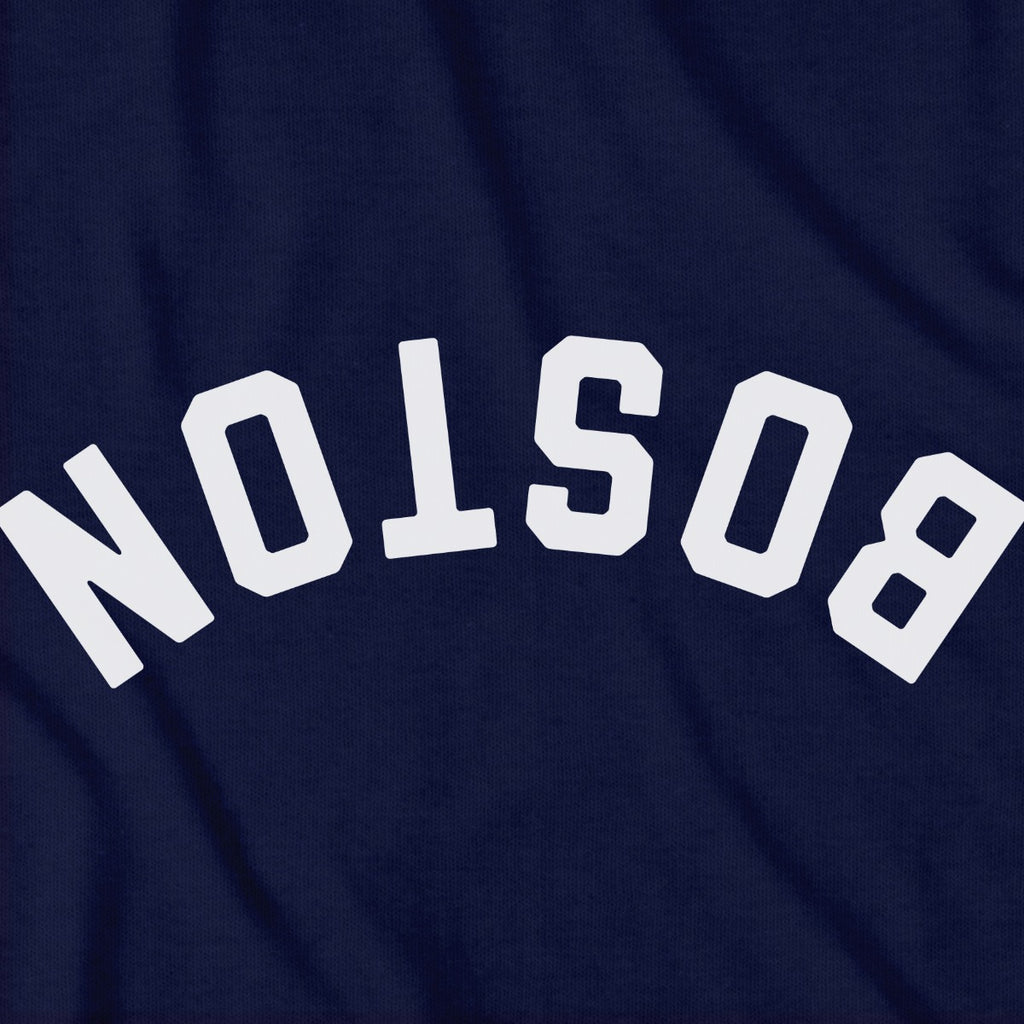 Close-up of Upside Down Arch t-shirt design in navy — inverted Boston arch detail