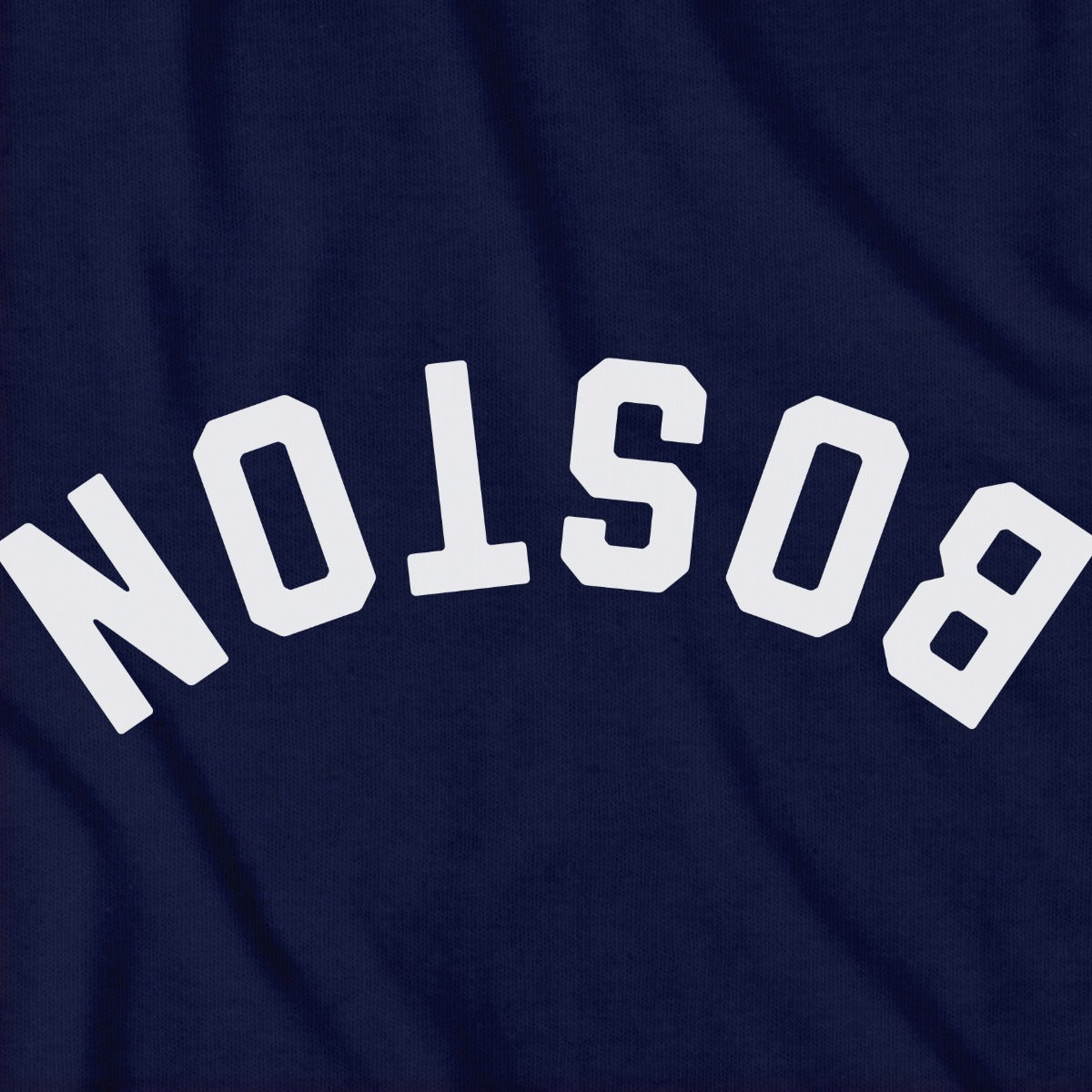 Close-up of Upside Down Arch t-shirt design in navy — inverted Boston arch detail
